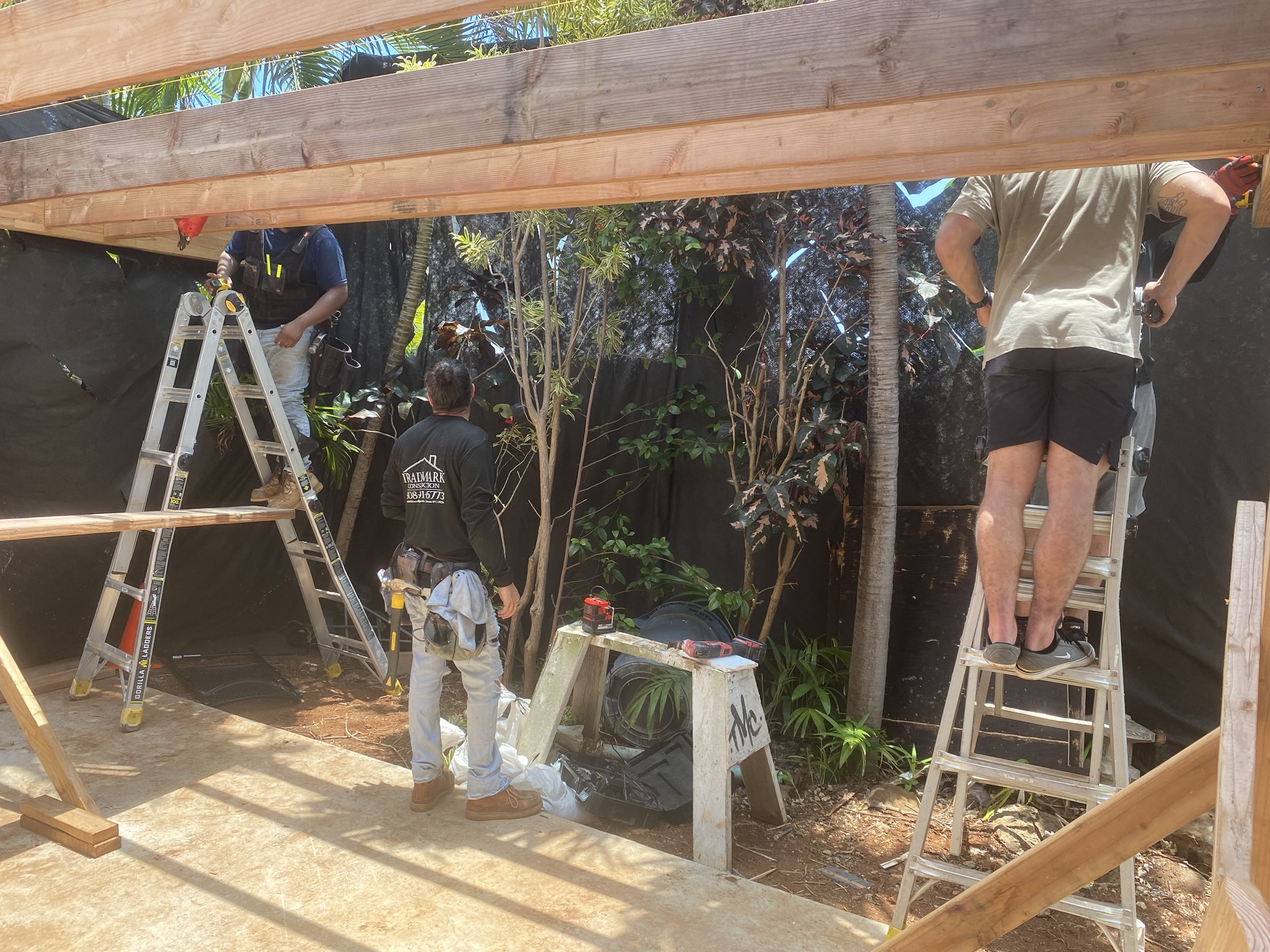 Trademark Construction crew building an outdoor structure